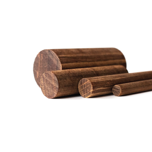 Three wooden dowels of varying diameters are arranged side by side on a white background, showing the circular ends and wood grain patterns.
