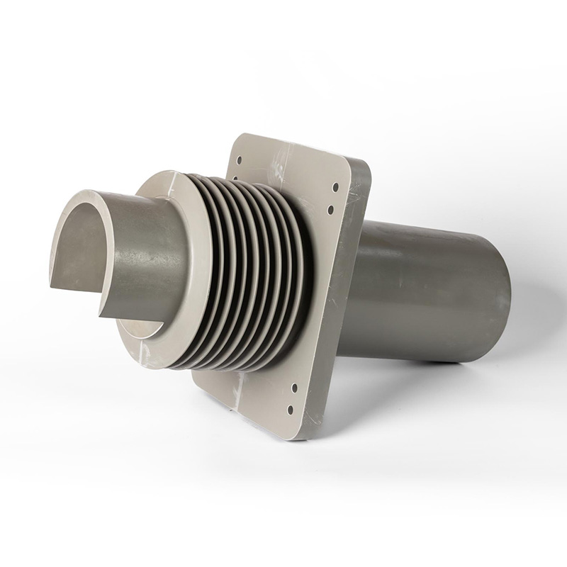 Gray plastic pipe fitting with a ribbed, flexible section, a flat square mounting plate with screw holes, and a partial cylinder attached to the front, all set against a white background.