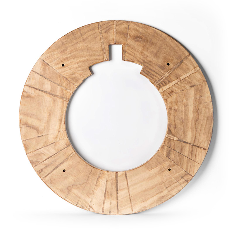 A round wooden frame with four small holes and a rectangular cutout at the top, set against a white background. The wood has a natural grain pattern and radial grooves.